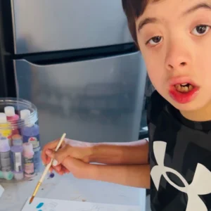 Little down boy painting